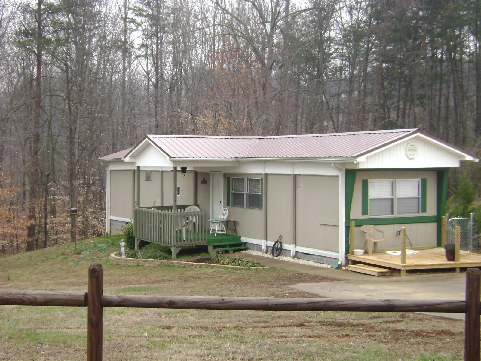 Mauve metal roof on a manufactured home with a new front deck in Kingston Springs